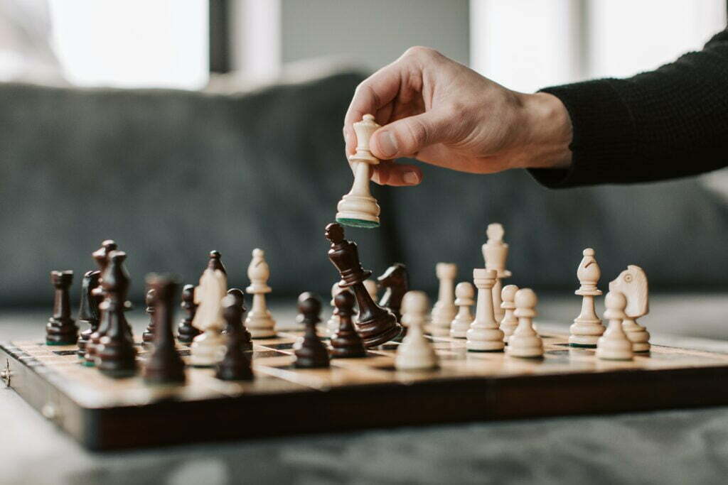 man holding chessboard